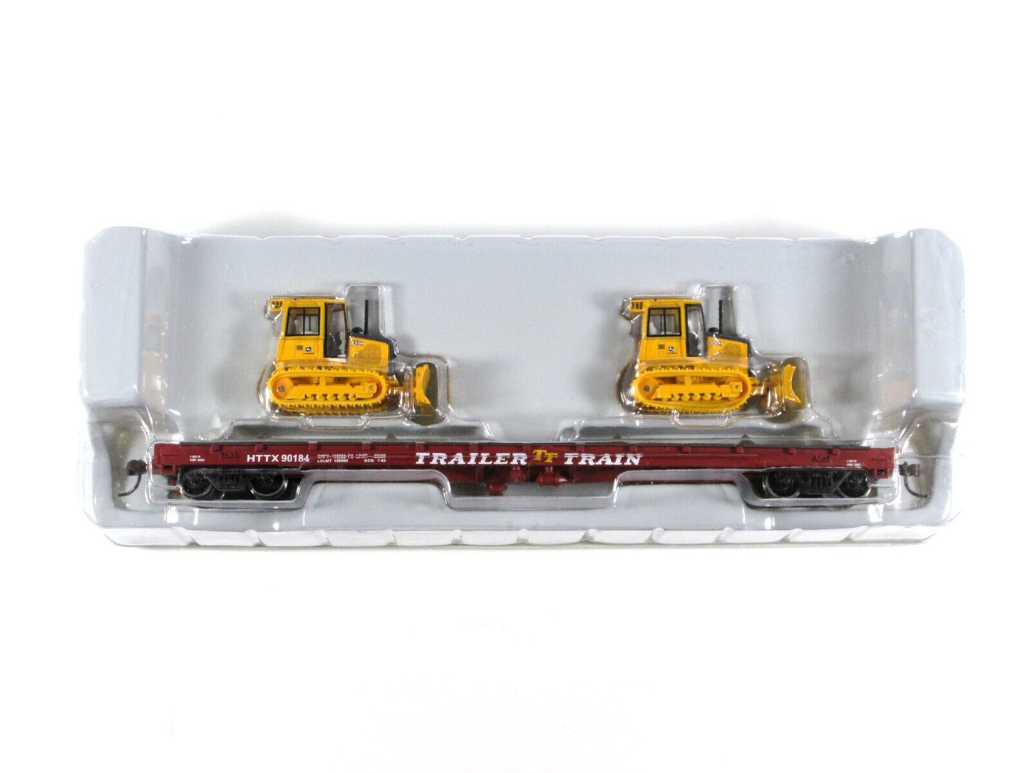 HO Scale ***TRAILER TRAIN*** 50' Flat Car w/ John Deere Dozers --- Athearn 81934