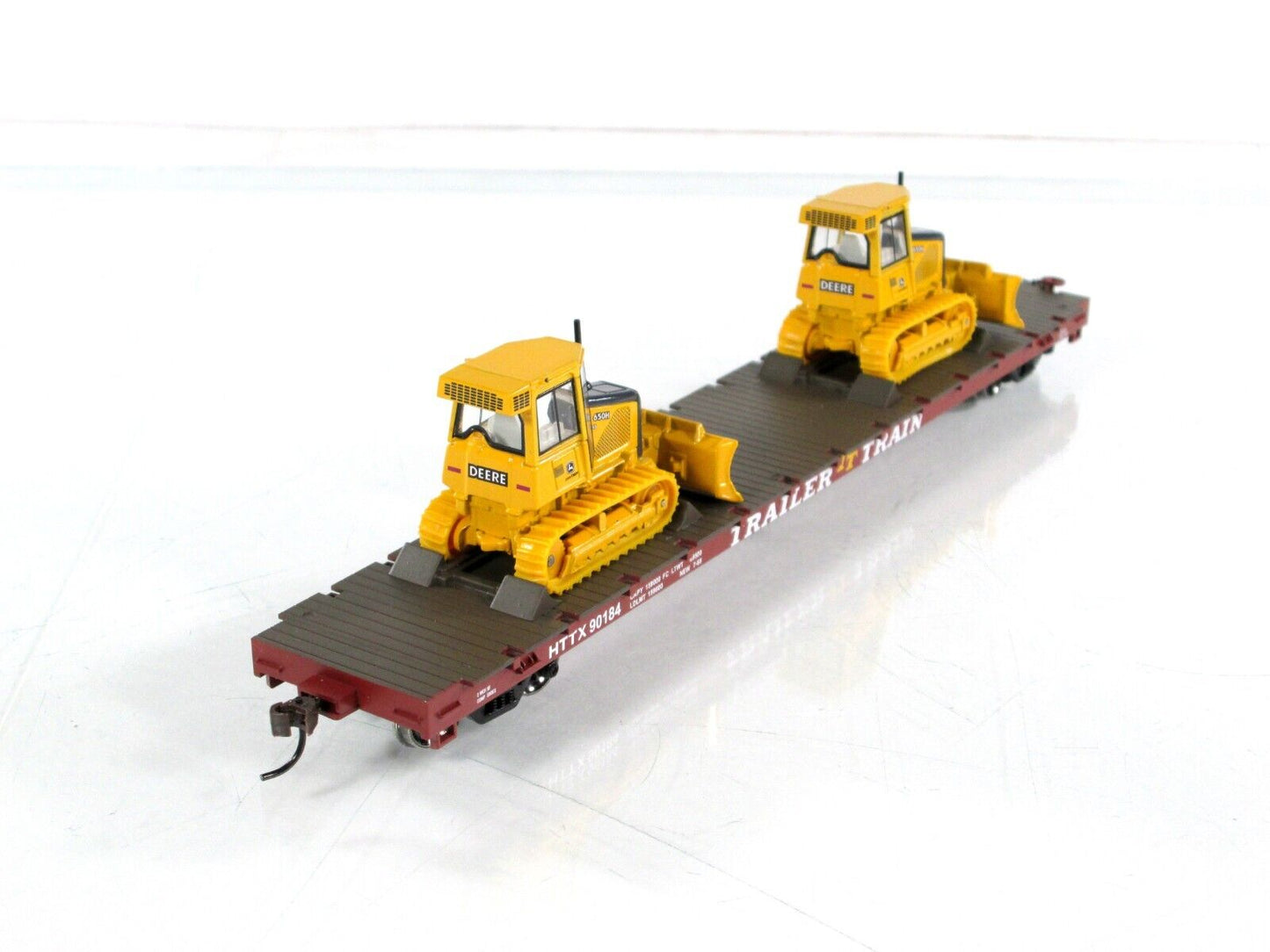 HO Scale ***TRAILER TRAIN*** 50' Flat Car w/ John Deere Dozers --- Athearn 81934