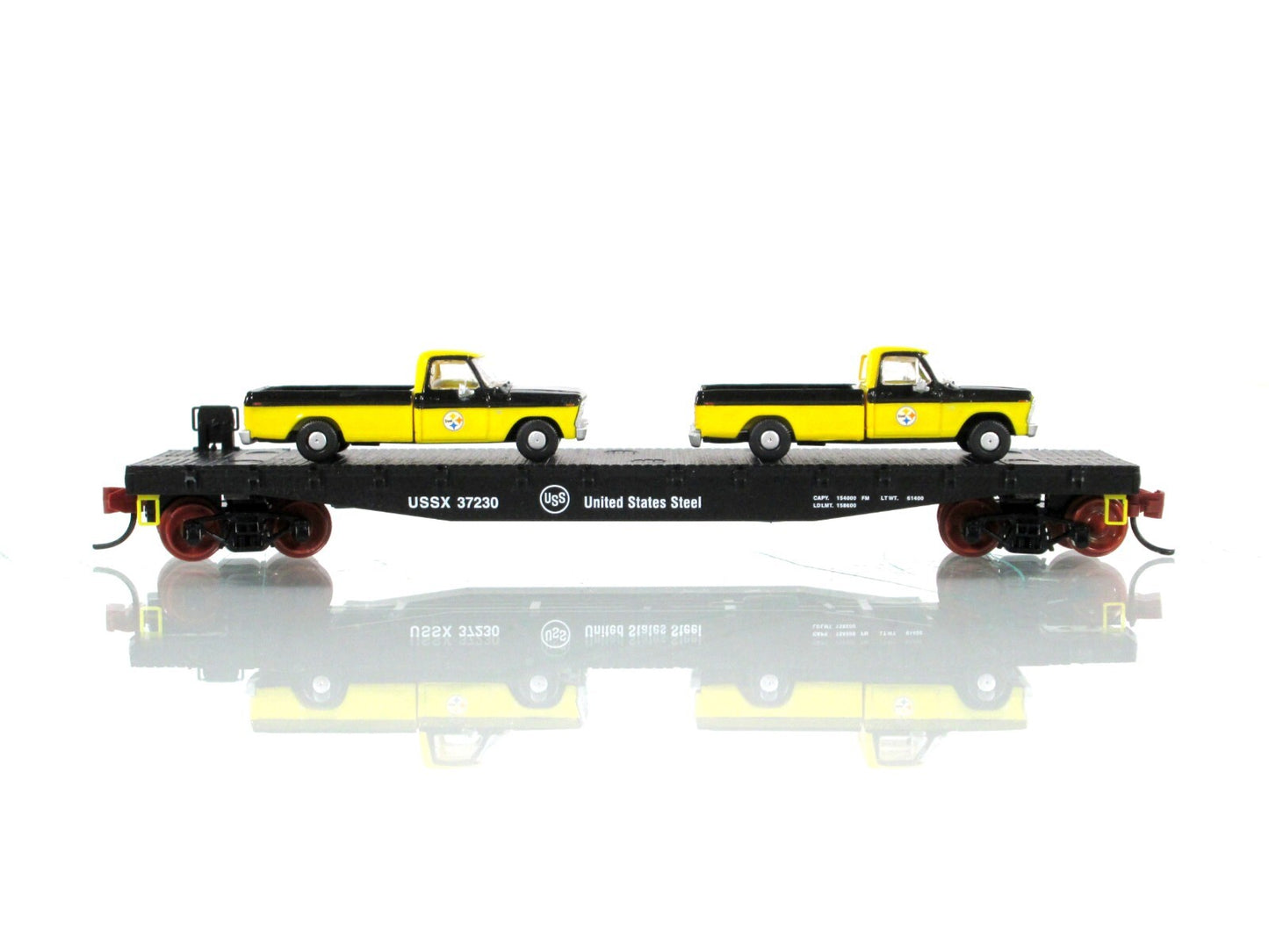 N Scale ***US STEEL*** Flat Car w/ Ford Pickup Load - Micro Trains NSE 23-18